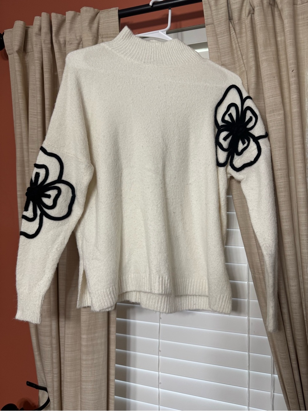 Staccato Cream Mock Neck Sweater with Black Floral Appliqué